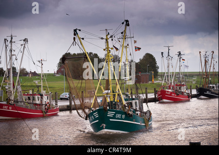 Shrimp trawler or shrimper in the harbour of Greetsiel, East Frisia, Lower Saxony, Germany, Europe Stock Photo