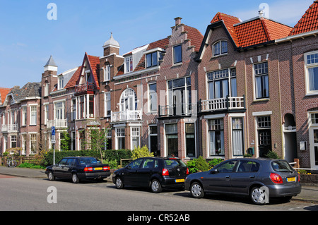 Parked cars in front of a row of houses, Alkmaar, North Holland, Holland, Netherlands, Europe Stock Photo