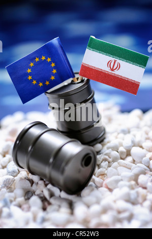 EU flag and flag of Iran in oil drums, symbolic image for an oil embargo by the EU against Iran Stock Photo