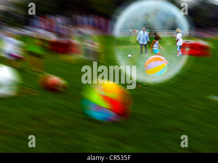 People in a bubble Stock Photo