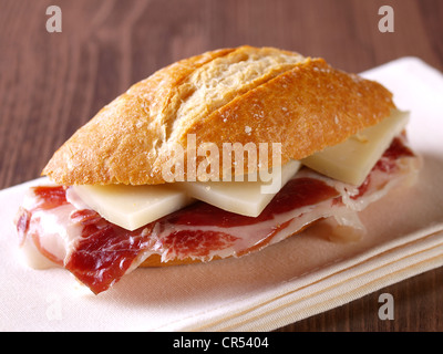 Cured ham and cheese sandwich. Bocadillo de jamón serrano y queso. Stock Photo
