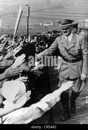 Hitler, Adolf, 20.4.1889 - 30.4.1945, German politician (NSDAP), Fuehrer and Reich Chancellor since 1933, half length, harvest festival, Bueckeberg, 1.10.1934, handshake with people from the crowd, Stock Photo
