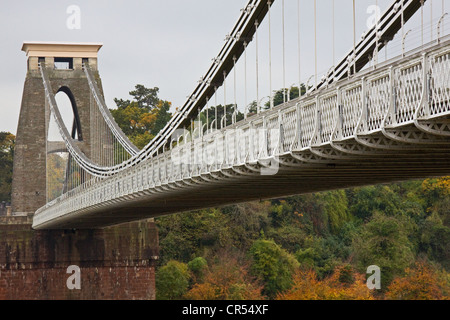 Brunel's Clifton suspension bridge seen from the Bristol side of the Avon Gorge in autumn, with Leighwoods in the background Stock Photo