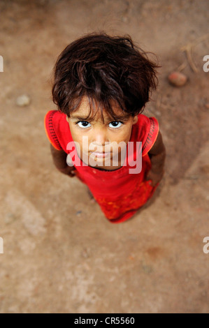 Christian girl who lives and works with her family under the slavery-like practice of debt bondage in a brick factory, Lahore Stock Photo