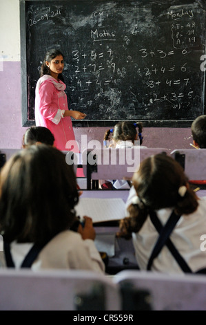 Teacher at the blackboard in a school of the Christian community in Lahore, Punjab, Pakistan, Asia Stock Photo