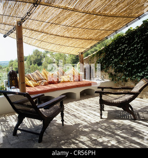 Provencal farmhouse decorated with Oriental textiles, furniture and objects Stock Photo
