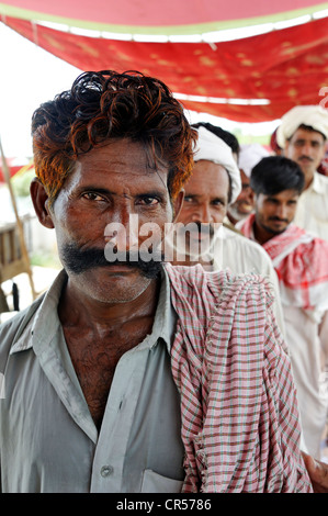 Man with a large mustache and henna-dyed hair, portrait, Muzaffaragarh, Punjab, Pakistan, Asia Stock Photo