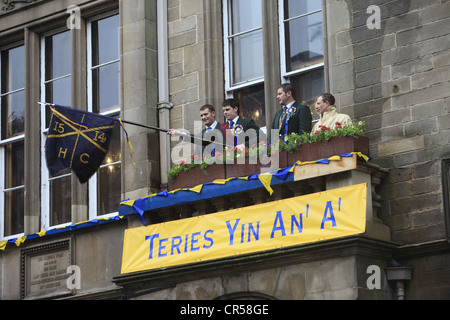 The Cornet, Acting Father, Left & Right hand man waves the flag at the end of  Hawick Common-Riding in the border town, Scotland Stock Photo