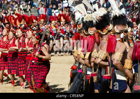 Warriors of different tribes performing ritual dances at the Hornbill Festival, Kohima, Nagaland, India, Asia Stock Photo