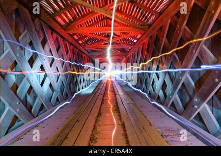 supernatural light inside of a wooden tunnel Stock Photo