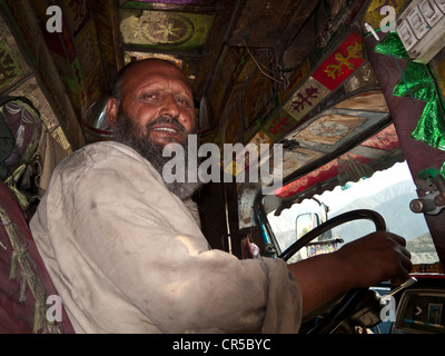 Pakistani truck driver, proud of his colorful vehicle, Gilgit, North ...