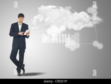 Businessman with touch screen Internet Tablet and the cloud computing concept and business network Stock Photo