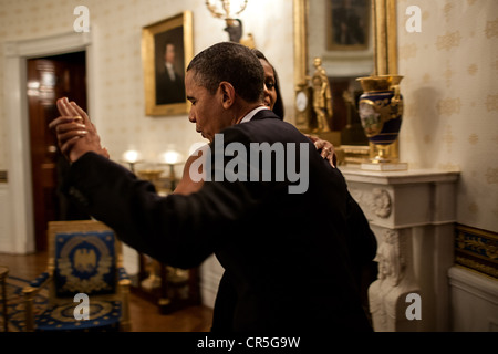 US President Barack Obama dances with First Lady Michelle Obama in the Blue Room of the White House prior to an 'In Performance at the White House' series concert honoring songwriters Burt Bacharach and Hal David May 9, 2012 in Washington, DC. Stock Photo