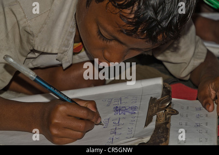 Child in the government school in Borbil still studies on the floor, India, Asia Stock Photo