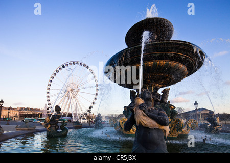 France, Paris, the fountain of the Rivers on the the Place de la Concorde and the Big Wheel (2009) Stock Photo