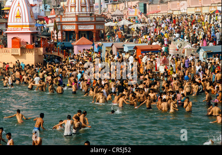 Pilgrims bathing and praying at Har Ki Pairi ghat by the 