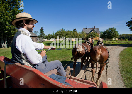 Canada New Brunswick Acadia Fredericton Kings Landing recreated village horse-drawn carriage trip with a guide in period outfit Stock Photo