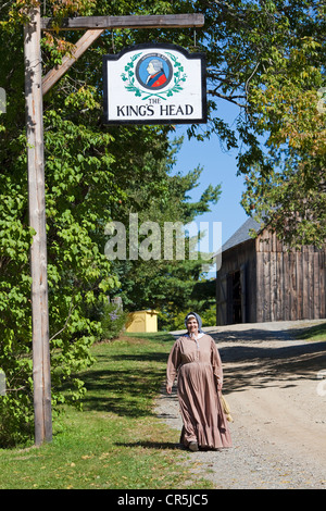 Canada, New Brunswick, Acadia, Fredericton, Kings Landing, recreated village, King's Head Inn, woman in costume Stock Photo