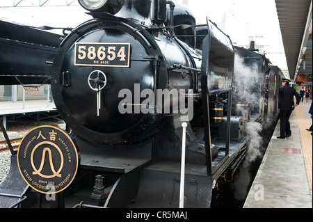 Japan, Kyushu Island, steam train at departure from the city of Kumamoto