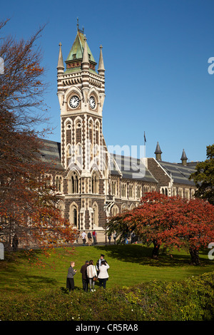 Graduation photos in front of the Clock Tower, Registry Building, University of Otago in Autumn, Dunedin, New Zealand Stock Photo