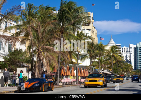 United States, Florida, Miami Beach, South Beach, Art Deco District, Ocean Drive, sports car and taxis Stock Photo