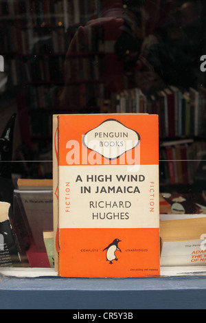 Hay on Wye bookshop old orange Penguin paperback book cover in second hand book shop window in Hay on Wye Powys Wales Stock Photo