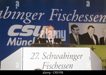 Mikhail Gorbachev, * 2.3.1931, Soviet politician (CPSU), half length, giving a speech, during a visit to Munich, Germany, 6.3.1992, in the background a picture of him with the German politicians Theodor 'Theo' Waigel and Franz Josef Strauss, Stock Photo