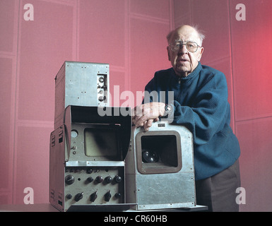 Hewel, Horst, *25.04.1908, German engineer, half length, first German viewer, receiving first test screens of the German Reichspost with self-made devices in 1929, here: with the first post-war-camera made by him, iconoscope camera (right) with mix device and emitter, Berlin, Germany, 16.1.1996, Stock Photo