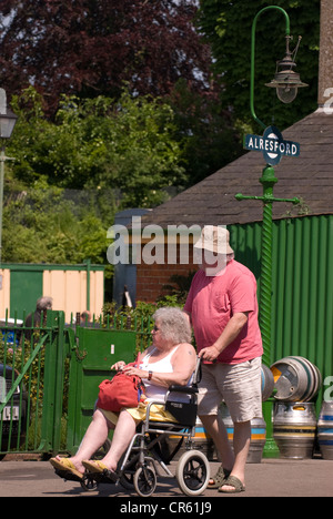 Elderly couple on Alresford train station platform, Watercress Line, Alresford, Hampshire, UK. Stock Photo