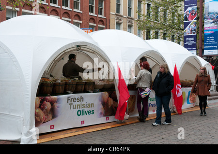 A market in St Anne's Square, Manchester selling Tunisian Olives. Stock Photo