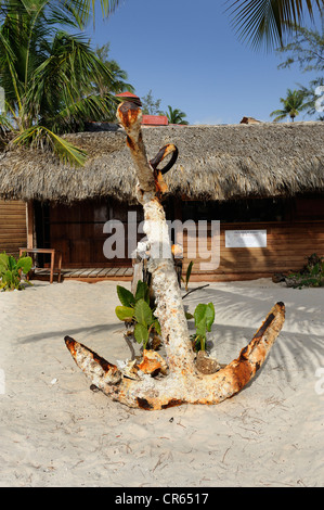 Old, rusty ship anchor on the beach in Punta Cana, Dominican Republic, Caribbean Stock Photo