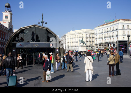 Local people and tourists in front of the entrance to the Metro Sol station on busy Puerta del Sol in Madrid, Spain. Stock Photo