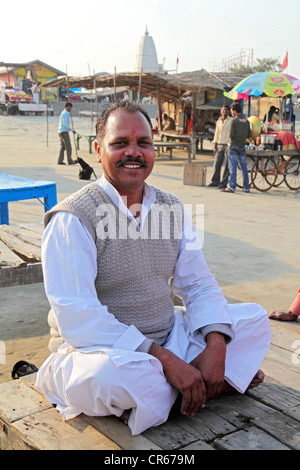 Man sitting alongside the Ganges River, Garhmukteshwar, Uttar Pradesh, North India, India, Asia Stock Photo