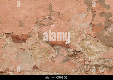 Wall with damaged plaster, background Stock Photo