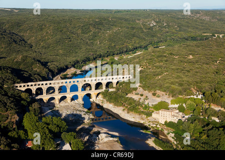 France, Gard, Pont du Gard, UNESCO World Heritage, Roman aqueduct stepping over the Gardon river (aerial view) Stock Photo