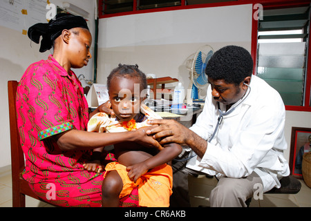Doctor examining a child in a hospital, Manyemen, Cameroon, Africa Stock Photo
