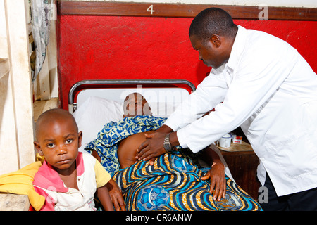 Doctor examining a pregnant woman, ward round, hospital, Manyemen, Cameroon, Africa Stock Photo