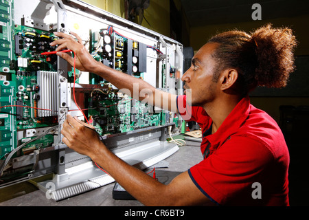 Young man being trained as electrical engineers, Sukabumi, Bandung, Java, Indonesia, Southeast Asia Stock Photo