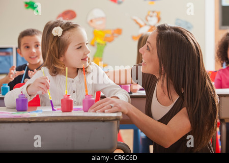 USA, Utah, Orem, Teacher with children (2-3, 4-5, 6-7) during art classes Stock Photo
