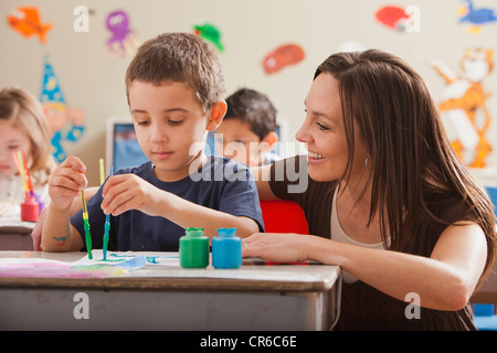 USA, Utah, Orem, Teacher with children (4-5, 6-7) during art classes Stock Photo