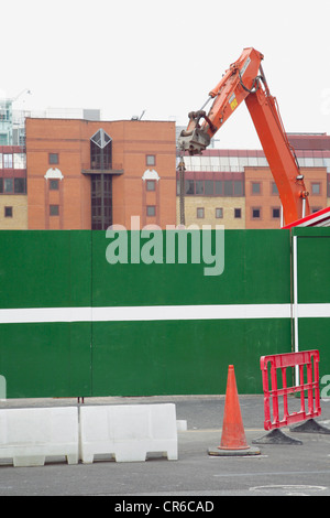 Great Britain, London, View of construction site with fence and crane Stock Photo