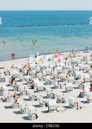 Germany,Ruegen, Binz,  People in beach booth at Island of Rugen Stock Photo