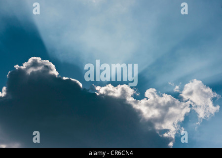 Germany, Sunbeam through cloudscape Stock Photo