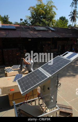 Laos Vientiane , lao-german company Sunlabob install solar power modules and photovoltaic in remoted villages for rural electrification with off-grid solution Stock Photo