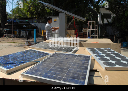 Laos Vientiane , lao-german company Sunlabob install solar power modules and photovoltaic in remoted villages for rural electrification with off-grid solution Stock Photo