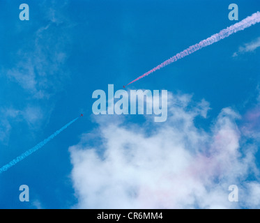 Hawk jets of the Red Arrows, Britain's RAF aerobatic team, perform in blue skies. Stock Photo