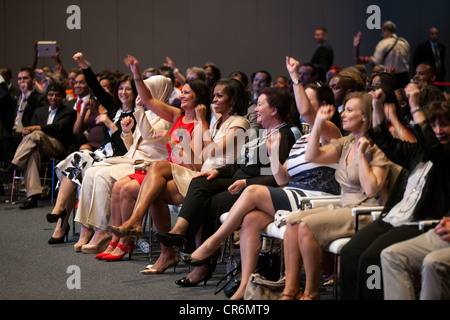 US First Lady Michelle Obama and the spouses of NATO Summit leaders watch a performance at the Gary Comer Youth Center May 20, 2012 in Chicago, IL. Stock Photo