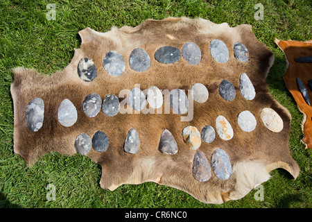 Collection of Flints, stone age axes and tools used for chopping and cutting like knife, displayed on goat skin Stock Photo