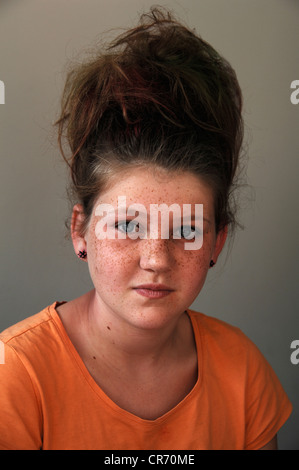 Girl, 11 years old, with teased hair and freckles, portrait Stock Photo