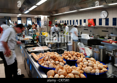 Kitchen of a school of hotel management, Lycee Economique et Hôtelier Joseph Storck, trainees, motion blur, freshly baked rolls Stock Photo